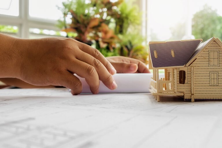 Hands of Engineer working on blueprint,Construction concept